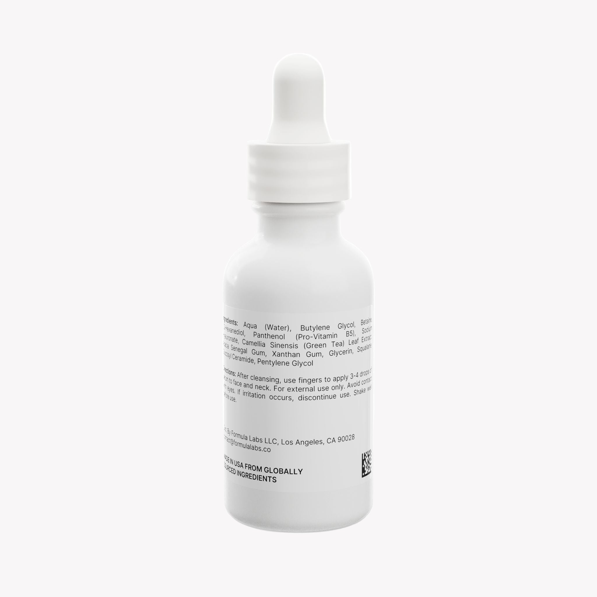 White dropper bottle with label on a white background