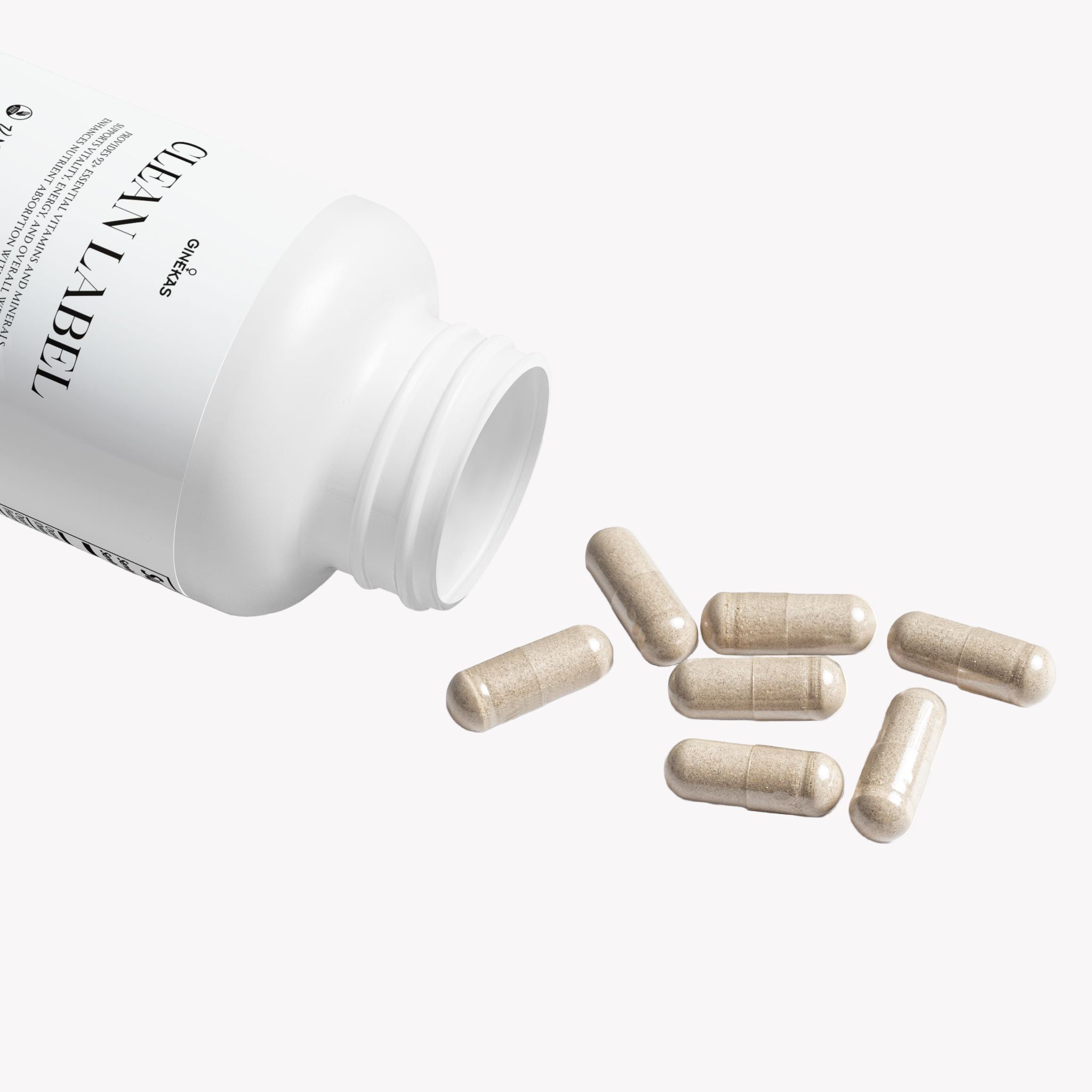 White supplement bottle with 'Clear Label' branding and scattered capsules on a white background