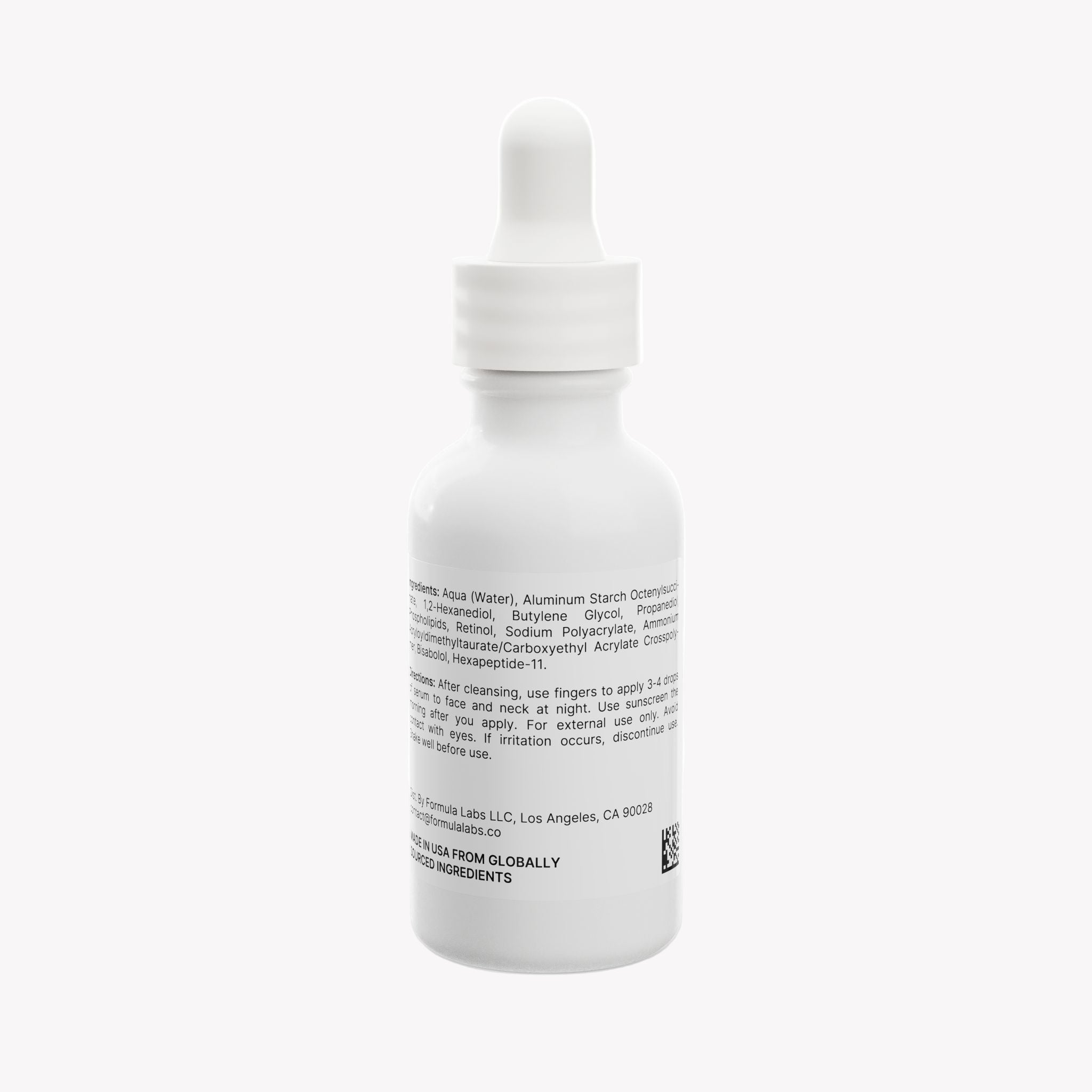 White dropper bottle with label on a white background